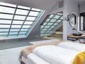 Schlafzimmer mit angeschlossener Sauna