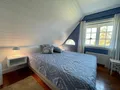 Doppelschlafzimmer mit Gartenblick im Obergeschoss