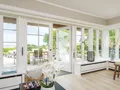 Wohnbereich mit Zugang zur Ostterrasse mit herrlichem Wattblick