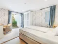 Einzelschlafzimmer mit Souterrainterrasse